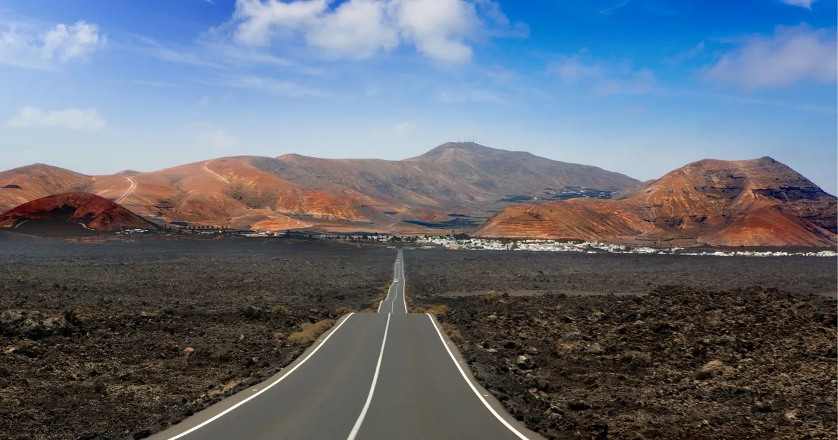 The LZ-67 road crossing the volcanic lava fields near Timanfaya, Lanzarote